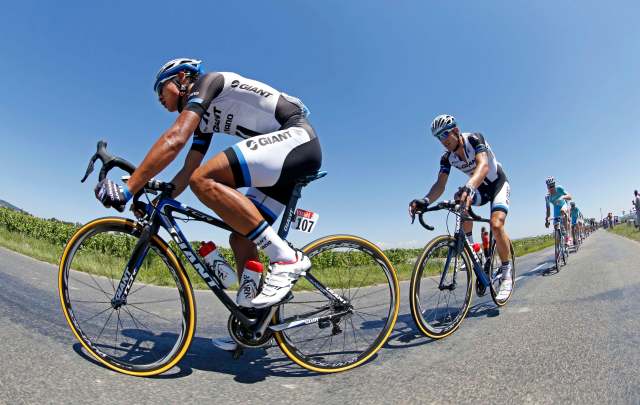 Giant-Shimano team rider Cheng Ji of China leads the pack of riders during the 185.5-km 12th stage of the Tour de France cycling race