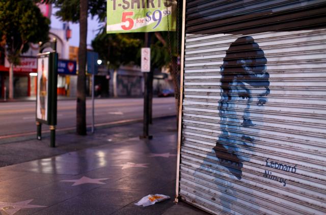 File photo of actor Leonard Nimoy's picture is painted on a storefront security gate along Hollywood Boulevard  in Hollywood, California