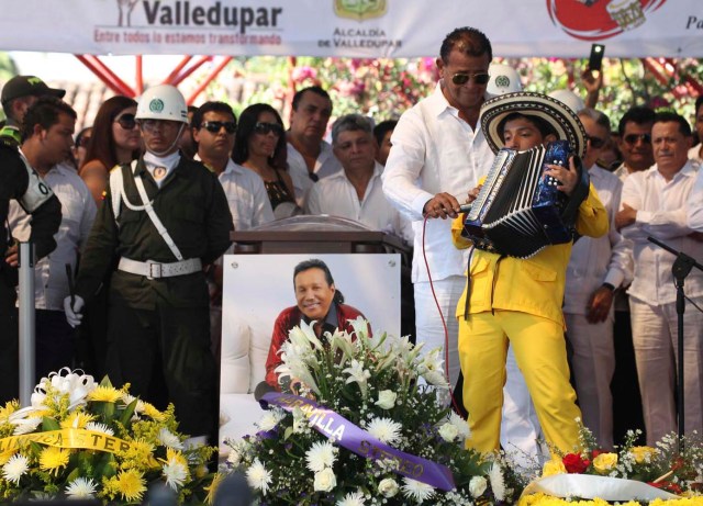 Child plays the accordion during a musical homage to musician Diomedes Diaz during a funeral ceremony at the main square of Valledupar