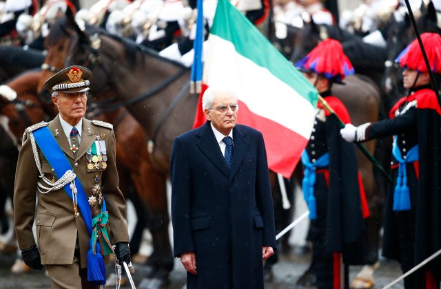 Italy's new President Sergio Mattarella inspects a guard of honour during a welcoming ceremony at the Quirinale presidential palace in Rome