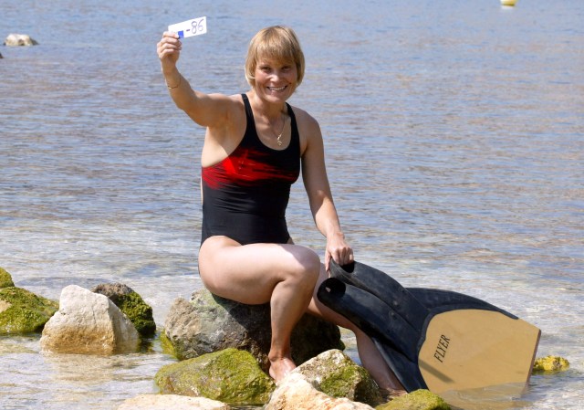 (FILES) -- A file photo taken on September 3, 2005 shows Russian Natalia Molchanova holding the minus 86 metres tag that gives her a win in the first women's free-diving world championship in Villefranche-sur-Mer. Molchanova, 53, has been reported missing since August 2, 2015 following a fun dive off the coast of Formentera. AFP PHOTO JACQUES MUNCH