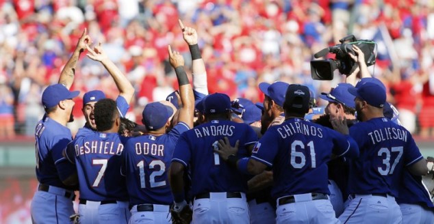 ARLINGTON, TX - OCTOBER 4: The Texas Rangers celebrate winning the AL West title after a baseball game against the Los Angeles Angels at Globe Life Park on October 4, 2015 in Arlington, Texas. Texas won 9-2.   Brandon Wade/Getty Images/AFP