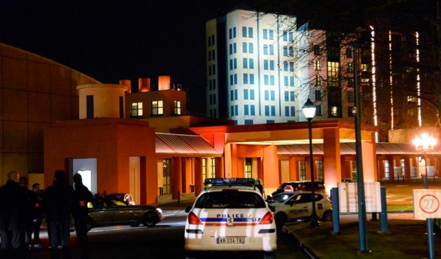 French police officers stand guard after a man carrying two handguns, ammunition and a Koran was arrested on January 28, 2016 at a hotel in Disneyland Paris in Marne-la-Vallée. The man was "detected" upon his arrival at the Disneyland hotel where he had a reservation. France is on high alert after a devastating terror attack in November saw Islamic State group gunmen and suicide bombers target Paris cafes, a concert venue and the Stade de France national stadium, leaving 130 dead and hundreds injured. / AFP / BERTRAND GUAY