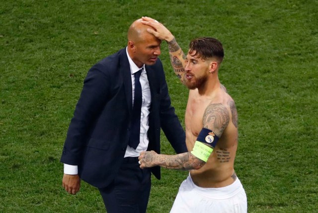 Football Soccer - Real Madrid v Atletico Madrid - UEFA Champions League Final - San Siro Stadium, Milan, Italy - 28/5/16 Real Madrid's coach Zinedine Zidane and Sergio Ramos celebrate after winning the Champions League final.      REUTERS/Tony Gentile