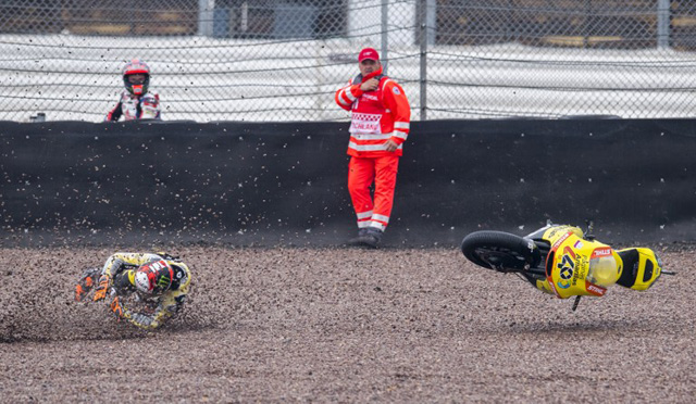 Kalex rider Alex Rins of Spain falls during the Moto2 race of the Grand Prix of Germany at the Sachsenring Circuit on July 17, 2016 in Hohenstein-Ernstthal, eastern Germany. / AFP PHOTO / Robert MICHAEL