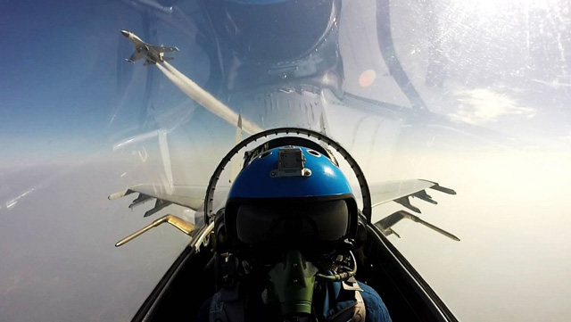 This undated photo shows two Chinese jet fighters during a military drill in the South China Sea near China's Hainan Island. An area off the east coast of China's island province of Hainan hosted military exercises from July 19 to 21. / AFP PHOTO / STR / China OUT