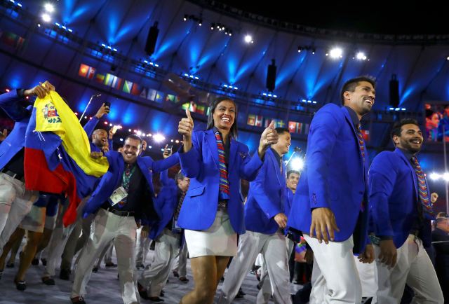 2016 Rio Olympics - Opening ceremony - Maracana - Rio de Janeiro, Brazil - 05/08/2016. Venezuela arrive in the stadium for the opening ceremony. REUTERS/Kai Pfaffenbach FOR EDITORIAL USE ONLY. NOT FOR SALE FOR MARKETING OR ADVERTISING CAMPAIGNS.