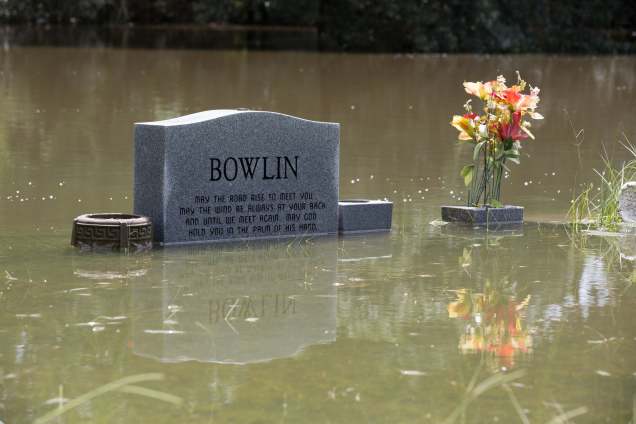 The floodwaters recede from Bethel United Methodist Cemetery in Greenwell Springs, Louisiana, U.S., August 14, 2016. REUTERS/Jeffrey Dubinsky