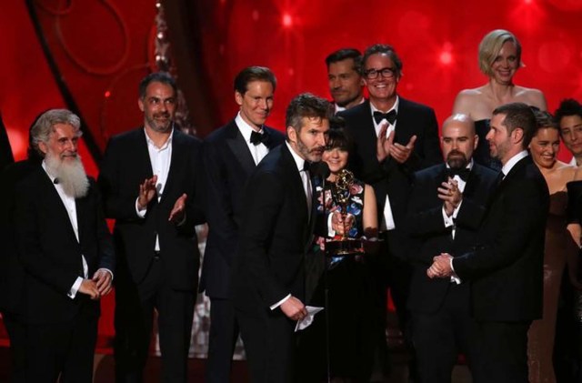 Executive Producers David Benioff (C) and D.B. Weiss (R) accept the award for Oustanding Drama Series for "Game of Thrones" at the 68th Primetime Emmy Awards in Los Angeles, California, U.S., September 18, 2016. REUTERS/Mike Blake