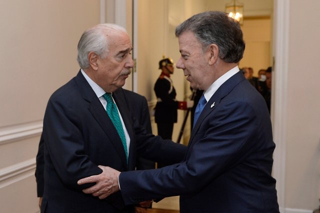 Colombian former President Andres Pastrana greets President Juan Manuel Santos at Narino Palace in Bogota