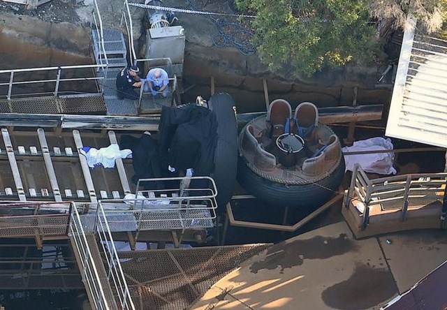 Emergency services personnel can be seen near a ride inside the Dreamworld theme park at Coomera on the Gold Coast, Australia, October 25, 2016 after a number of people were reported killed on a ride at Australia's biggest theme park. AAP/Dan Peled/via REUTERS