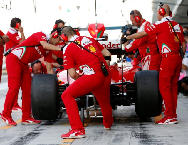 Formula One - F1 - Abu Dhabi Grand Prix - Yas Marina Circuit, Abu Dhabi, United Arab Emirates - 26/11/2016 - Ferrari's Formula One driver Sebastian Vettel of Germany stops at the pit lane during the third practice session. REUTERS/Ahmed Jadallah