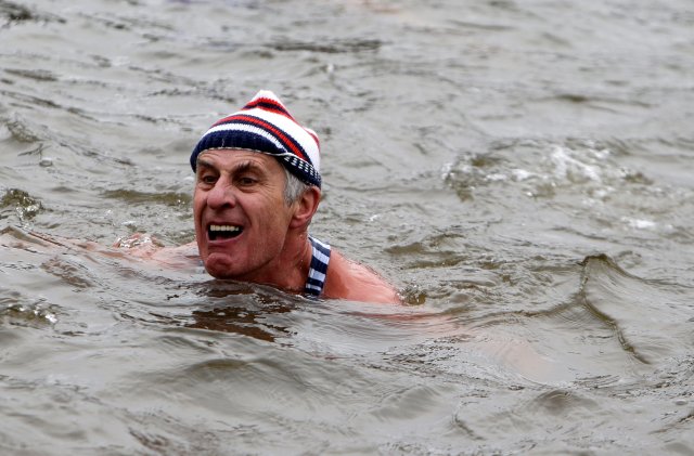 A swimmer participates in the annual Christmas winter swimming competition in the Vltava river in Prague, Czech Republic, December 26, 2016. REUTERS/David W Cerny