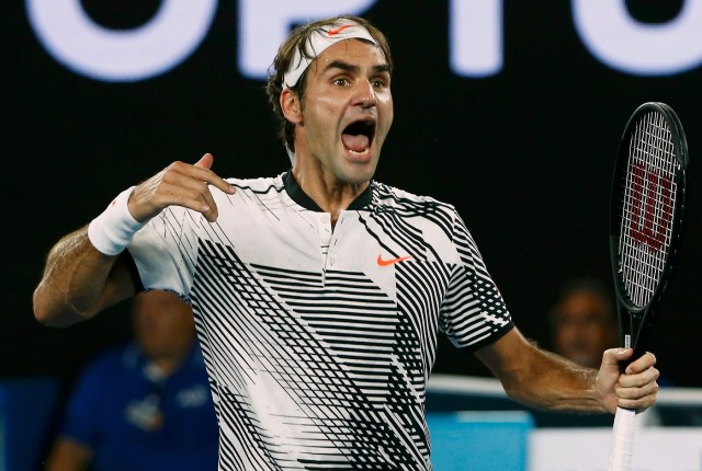 Tennis - Australian Open - Melbourne Park, Melbourne, Australia - 22/1/17 Switzerland's Roger Federer celebrates winning his Men's singles fourth round match against Japan's Kei Nishikori. REUTERS/Thomas Peter