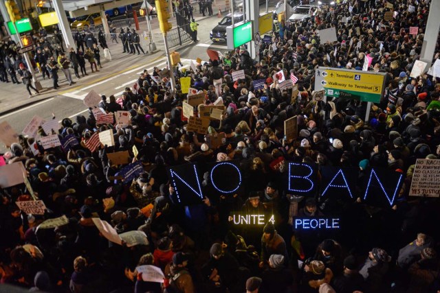 NEW YORK, NY - JANUARY 28: Protestors rally during a demonstration against the Muslim immigration ban at John F. Kennedy International Airport on January 28, 2017 in New York City. President Trump signed the controversial executive order that halted refugees and residents from predominantly Muslim countries from entering the United States. Stephanie Keith/Getty Images/AFP