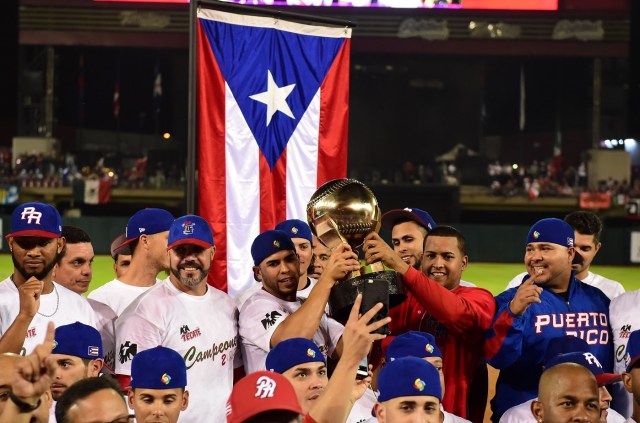 Players of Criollos de Caguas from Puerto Rico, celebrate their victory against Aguilas de Mexicali from Mexico during the final of Caribbean Baseball Series, at the Tomateros stadium, in Culiacan, Sinaloa State, Mexico, on February 7, 2017. / AFP PHOTO / RONALDO SCHEMIDT