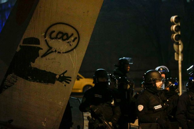 Anti riot police officers stand guard during a protest in Bobigny, a district of northeast Paris, to denounce police brutality after a black man was allegedly sodomised with a baton during an arrest while in their custody in Paris on February 11, 2017. A 22-year-old black youth worker named as Theo, a talented footballer with no criminal record, required surgery after his arrest on February 2, 2017 when he claims a police officer sodomized him with his baton. One officer has been charged with rape and three others with assault over the incident in the tough northeastern suburb of Aulnay-sous-Bois which has revived past controversies over alleged police brutality. / AFP PHOTO / GEOFFROY VAN DER HASSELT