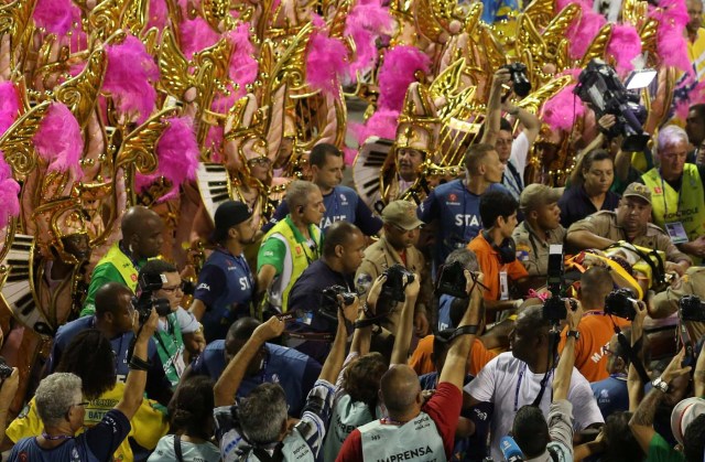 A reveller is assisted after an accident with a float from Unidos da Tijuca samba school during the second night of the carnival parade at the Sambadrome in Rio de Janeiro, Brazil February 28, 2017. REUTERS/Pilar Olivares