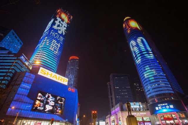 Shopping malls are seen before Earth Hour in Nanjing, Jiangsu province, China, March 25, 2017. Picture taken March 25, 2017. REUTERS/Stringer ATTENTION EDITORS - THIS IMAGE WAS PROVIDED BY A THIRD PARTY. EDITORIAL USE ONLY. CHINA OUT. NO COMMERCIAL OR EDITORIAL SALES IN CHINA.