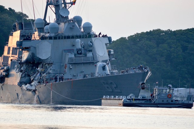 The U.S. Navy Arleigh Burke-class guided-missile destroyer USS Fitzgerald returns to Fleet Activities (FLEACT) Yokosuka following a collision with a merchant vessel while operating southwest of Yokosuka, Japan in photo received June 17, 2017. Courtesy of U.S. Navy/Mass Communication Specialist 1st Class Peter Burghart/Handout via REUTERS ATTENTION EDITORS - THIS IMAGE WAS PROVIDED BY A THIRD PARTY.