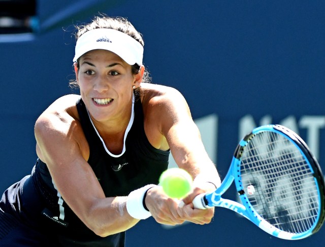 Aug 9, 2017; Toronto, Ontario, Canada; Garbine Muguruza of Spain plays a shot against Kirsten Flipkens of Belgium (not pictured) during the Rogers Cup tennis tournament at Aviva Centre. Mandatory Credit: Dan Hamilton-USA TODAY Sports