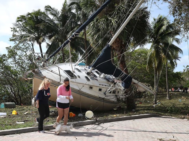 MIAMI, FL - SEPTEMBER 11: A boat is seen washed ashore at the Dinner Key marina after hurricane Irma passed through the area on September 11, 2017 in Miami, Florida. Florida took a direct hit from the Hurricane. Joe Raedle/Getty Images/AFP