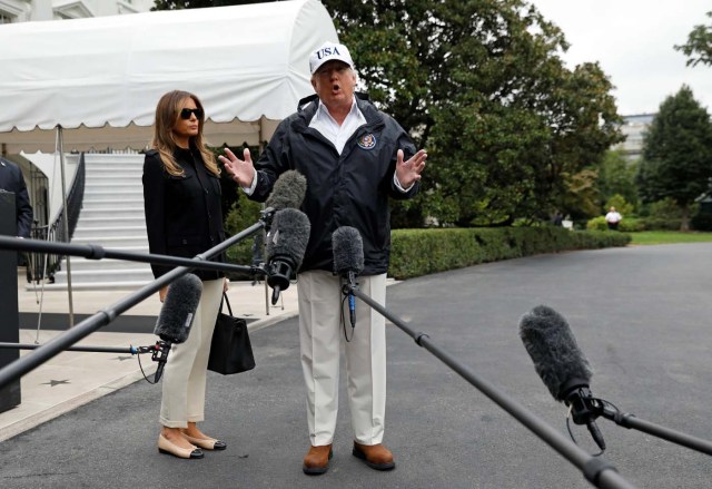 U.S. President Donald Trump speaks to reporters as he and First Lady Melania Trump depart the White House in Washington on their way to view storm damage in Florida, U.S., September 14, 2017. REUTERS/Kevin Lamarque