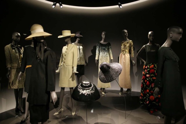 Dresses and hat creations are displayed at the Yves Saint Laurent Museum in Paris, France, September 27, 2017. The new museum, celebrating the life and work of French designer Yves Saint Laurent (1936-2008), will open at the avenue Marceau address of his former work studio for almost 30 years. Picture taken September 27, 2017. REUTERS/Stephane Mahe