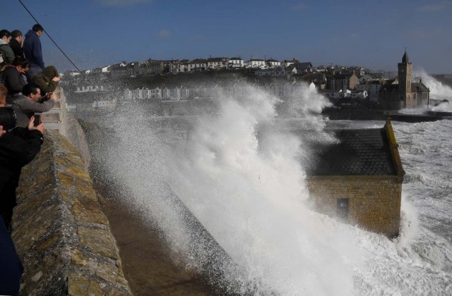 Large waves crash along sea defences and the harbour as Storm Ophelia approaches Porthleven in Cornwall, south west Britain, October 16, 2017. REUTERS/Toby Melville