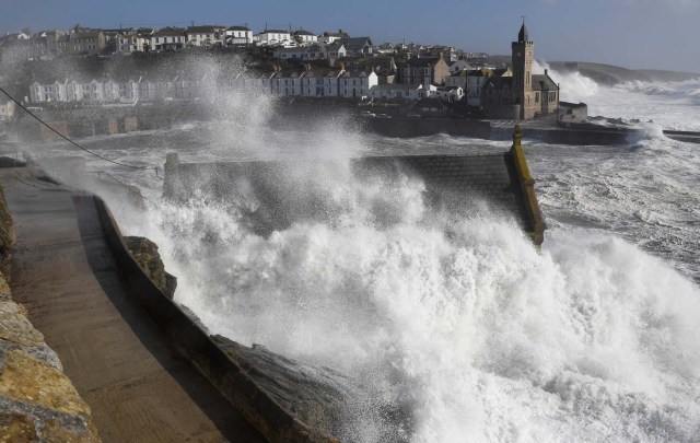 Large waves crash along sea defences and the harbour as storm Ophelia approaches Porthleven in Cornwall, south west Britain, October 16, 2017. REUTERS/Toby Melville