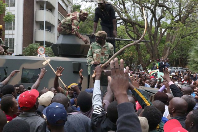 Protesters calling for Zimbabwean President Robert Mugabe to step down take to the streets in Harare, Zimbabwe, November 18, 2017. REUTERS/Philimon Bulawayo