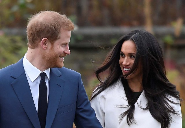 Britain's Prince Harry poses with Meghan Markle in the Sunken Garden of Kensington Palace, London, Britain, November 27, 2017. REUTERS/Toby Melville