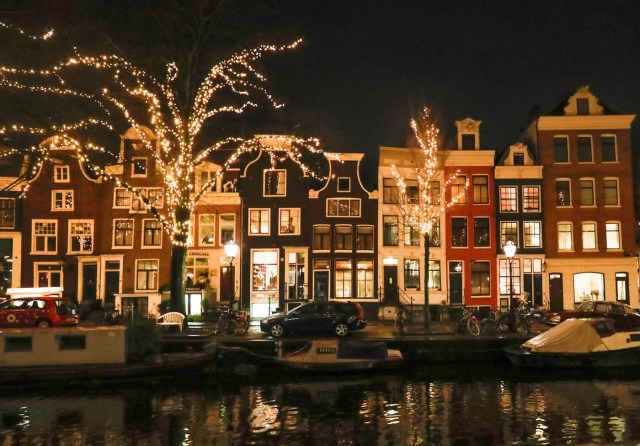 Trees are illuminated near a canal in central Amsterdam, Netherlands, November 30, 2017. Picture taken November 30, 2017. REUTERS/Yves Herman