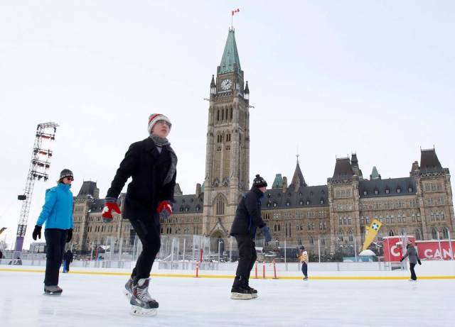 People brave the frigid weather to skate on an outdoor rink on Parliament Hill in Ottawa, Ontario, Canada, December 29, 2017. REUTERS/Patrick Doyle