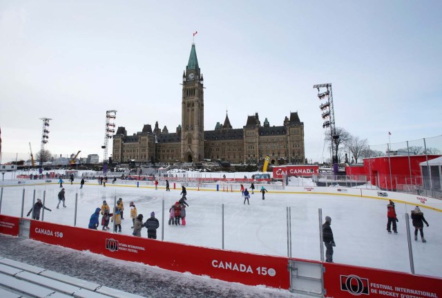 People brave the frigid weather to skate on an outdoor rink on Parliament Hill in Ottawa, Ontario, Canada, December 29, 2017. REUTERS/Patrick Doyle