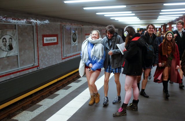 People take part in the annual flash mob "No Pants Subway Ride" in Berlin, Germany, January 7, 2018. REUTERS/Hannibal Hanschke