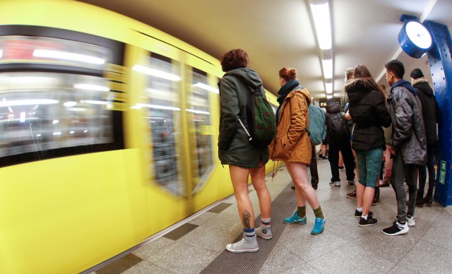 People take part in the annual flash mob "No Pants Subway Ride" in Berlin, Germany, January 7, 2018. Picture taken with a fish-eye lens. REUTERS/Hannibal Hanschke