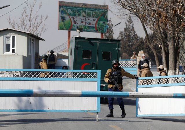 Afghan security forces stand guard at the enternce gate of the Intercontinental Hotel a day after an attack in Kabul, Afghanistan January 22, 2018. REUTERS/Omar Sobhani