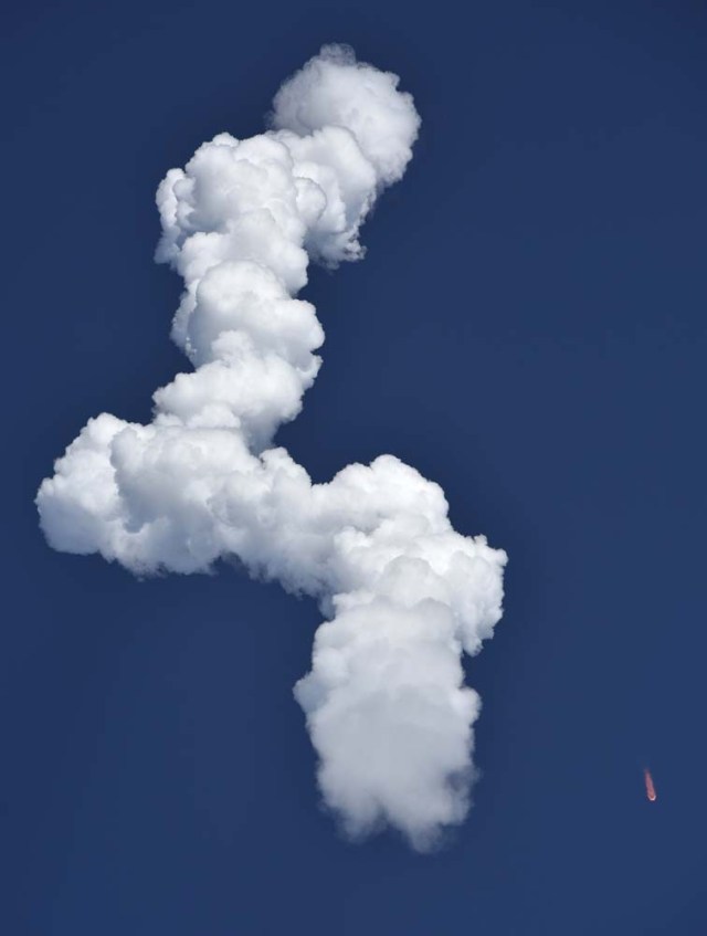 A SpaceX Falcon Heavy rocket leaves a smoke trail behind after lifting off from historic launch pad 39-A at the Kennedy Space Center in Cape Canaveral, Florida, U.S., February 6, 2018. REUTERS/Steve Nesius