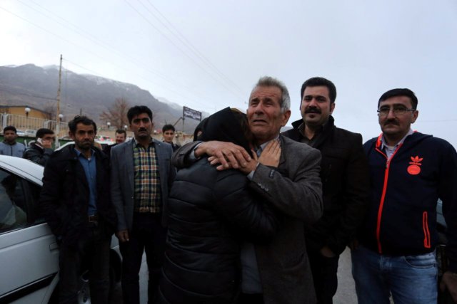 Relatives of a passenger who was believed to have been killed in a plane crash react near the town of Semirom, Iran, February 18, 2017. REUTERS/Tasnim News Agency ATTENTION EDITORS - THIS PICTURE WAS PROVIDED BY A THIRD PARTY.