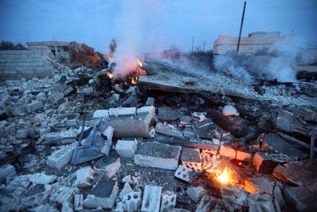 A picture taken on February 3, 2018, shows smoke billowing from the site of a downed Sukhoi-25 fighter jet near the Syrian city of Saraqib, southwest of Aleppo. Rebel fighters shot down a Russian plane over Syria's northwest Idlib province and captured its pilot, the Syrian Observatory for Human Rights said. / AFP PHOTO / OMAR HAJ KADOUR