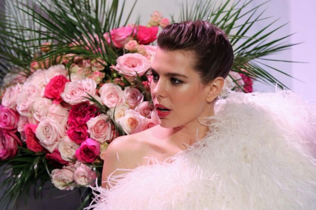 Charlotte Casiraghi reacts as she arrives for the annual Rose Ball at the Monte-Carlo Sporting Club in Monaco, on March 24, 2018. The Rose Ball is one of the major charity events in Monaco. Created in 1954, it benefits the Princess Grace Foundation. / AFP PHOTO / POOL / VALERY HACHE