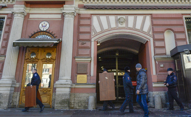 Employees move furniture out of the US Consulate in Saint Petersburg on March 30, 2018. Russia on Thursday announced a mass expulsion of US diplomats and the closure of the US consulate in Saint Petersburg in retaliation to coordinated moves by Western countries to isolate Moscow in the wake of the poisoning of a former double agent in Britain. / AFP PHOTO / OLGA MALTSEVA