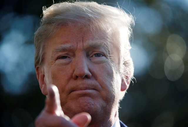 U.S. President Donald Trump gestures as he speaks with the media before boarding Marine One helicopter to depart for travel to California via Joint Base Andrews from the South Lawn of the White House in Washington, U.S., March 13, 2018. REUTERS/Leah Millis