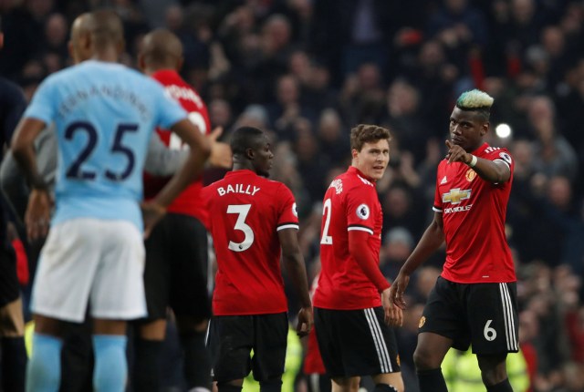 Soccer Football - Premier League - Manchester City vs Manchester United - Etihad Stadium, Manchester, Britain - April 7, 2018 Manchester United's Paul Pogba gestures towards Manchester City's Fernandinho Action Images via Reuters/Lee Smith EDITORIAL USE ONLY. No use with unauthorized audio, video, data, fixture lists, club/league logos or "live" services. Online in-match use limited to 75 images, no video emulation. No use in betting, games or single club/league/player publications. Please contact your account representative for further details.