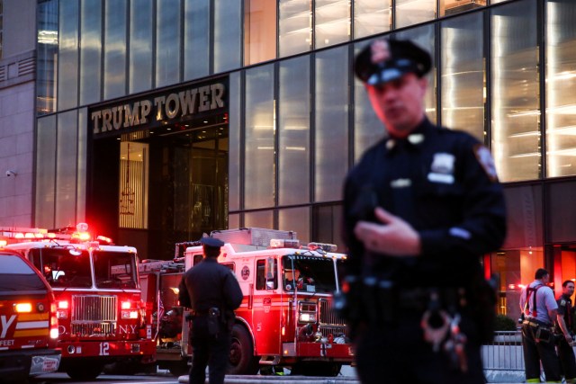 First responders work on a fire in a residential unit at Trump tower in the Manhattan borough of New York City, New York, U.S., April 7, 2018. REUTERS/Amr Alfiky