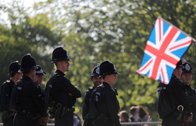 Police officers stand guard, ahead of the wedding of Prince Harry and Meghan Markle in Windsor, Britain, May 19, 2018. REUTERS/Marko Djurica