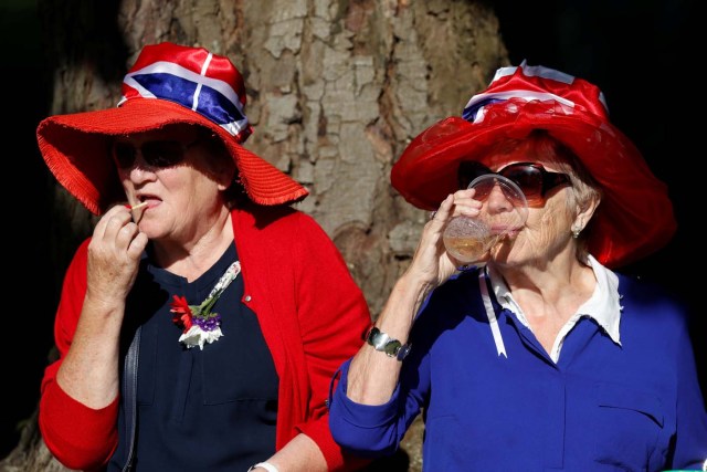 Royal fans gather outside Windsor Castle ahead of wedding of Britain's Prince Harry to Meghan Markle in Windsor, Britain, May 19, 2018. REUTERS/Damir Sagolj